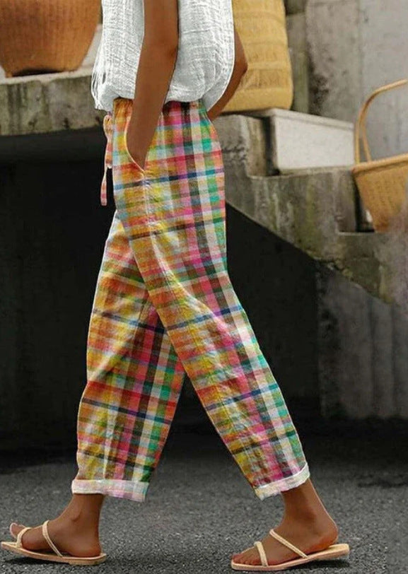 Women's checked linen trousers in palazzo cut with elastic tunnel drawstring waistband and rolled ankle hem Mune Fashion