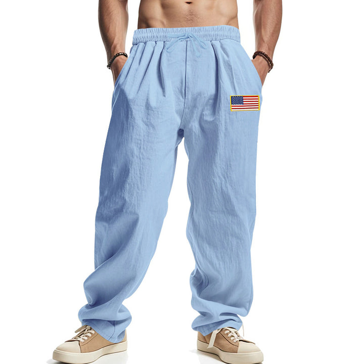 Men's loose-fitting leisure pants in linen look with elastic waist, drawstring & flag patch Mune Fashion