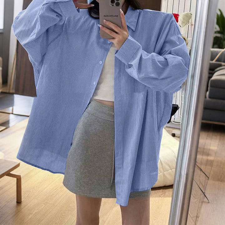 Women's oversized shirt with fine pinstripe structure, Kent collar, rounded hem, and buttoned cuffs Mune Fashion