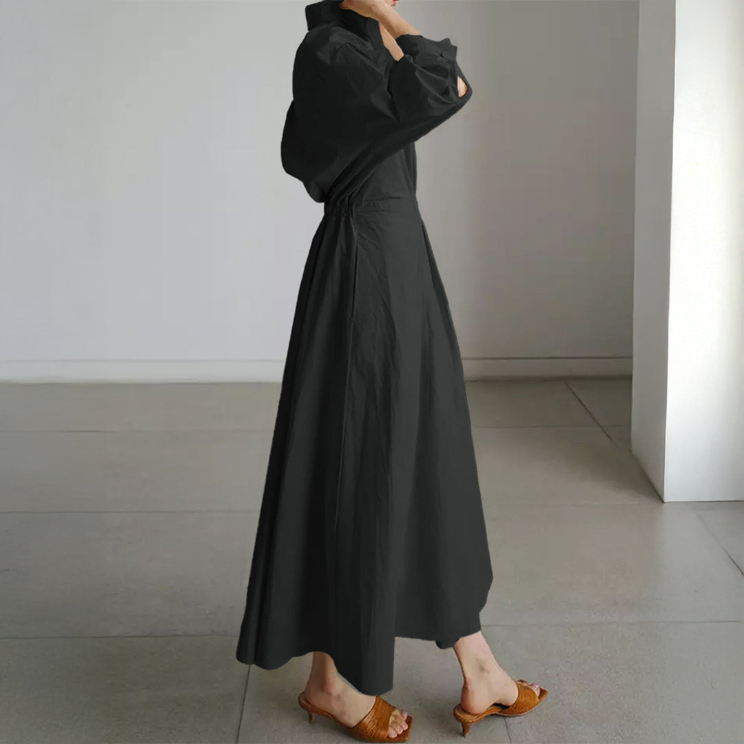 Women's tailored shirt dress with boxy collar, mid-length sleeves, side pockets, and flared pleated skirt Mune Fashion