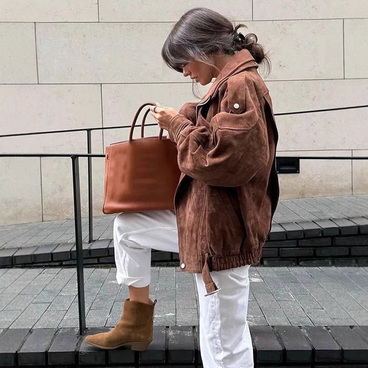 Women's oversized velour biker jacket with stand-up collar, shoulder flaps, and adjustable hip belt Mune Fashion
