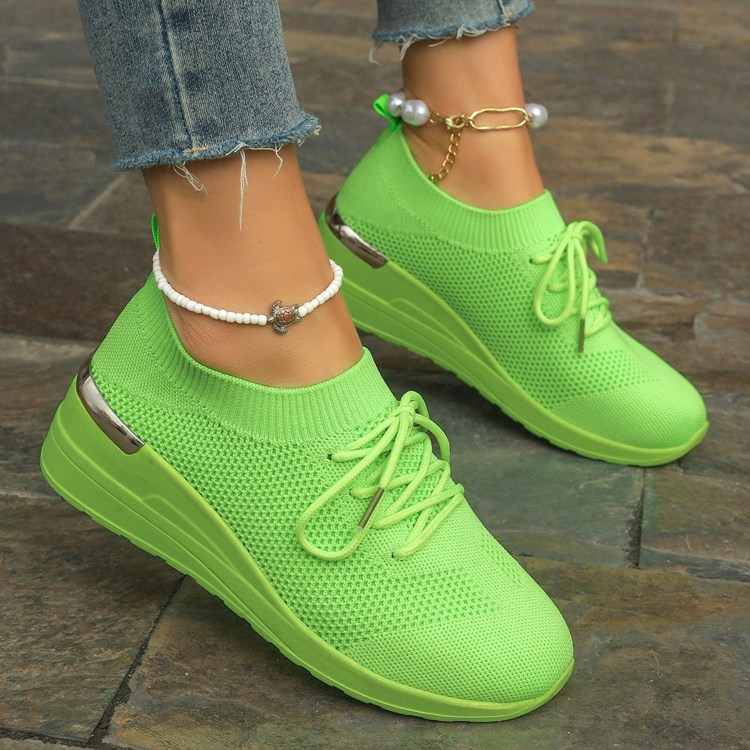 Women’s knit sneakers with wedge sole, sock-like shaft and metallic heel accent Mune Fashion