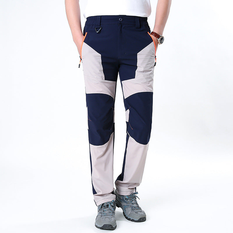 Men's functional trekking pants with reinforced knees, elastic waistband, and zipper pockets.