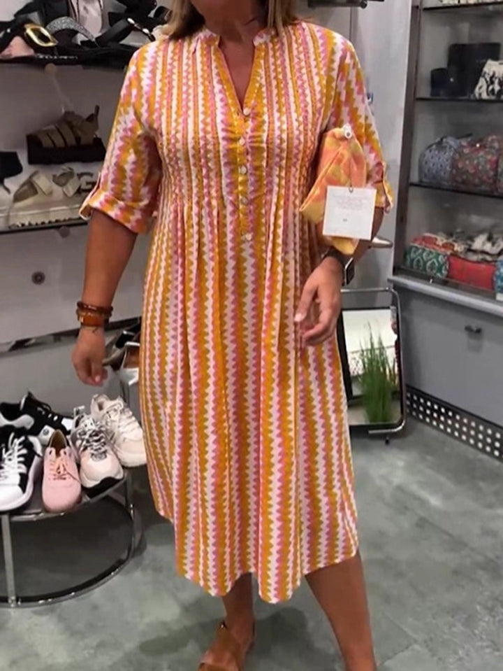 Ladies nan midi dress with underbust seam, V-neck, button placket and roll-up three-quarter sleeves Mune Fashion