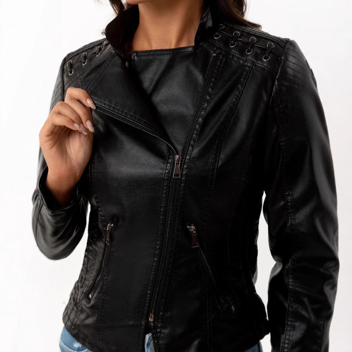 Ladies tailored faux leather biker jacket with quilted shoulder section, asymmetrical zipper and decorative eyelets Mune Fashion