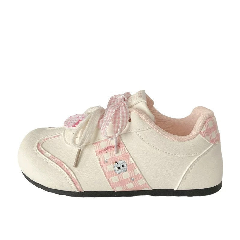 Women's sneakers with playful check pattern and decorative bows Mune Fashion