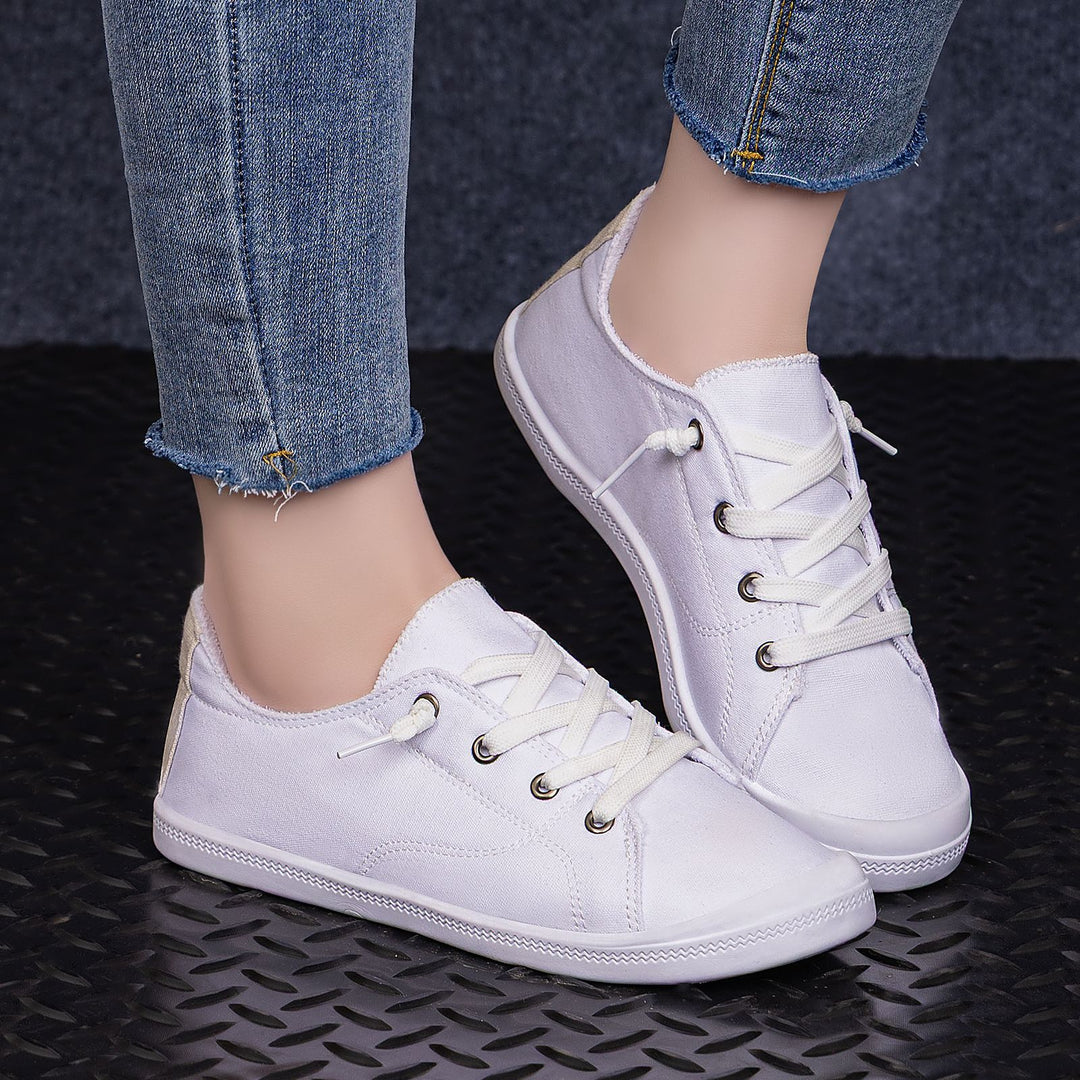 Women’s classic canvas low-top sneakers with reinforced rubber sole, metal eyelets, and padded heel collar Mune Fashion