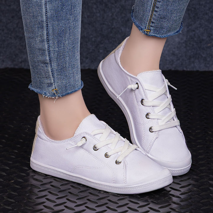 Women’s classic canvas low-top sneakers with reinforced rubber sole, metal eyelets, and padded heel collar Mune Fashion