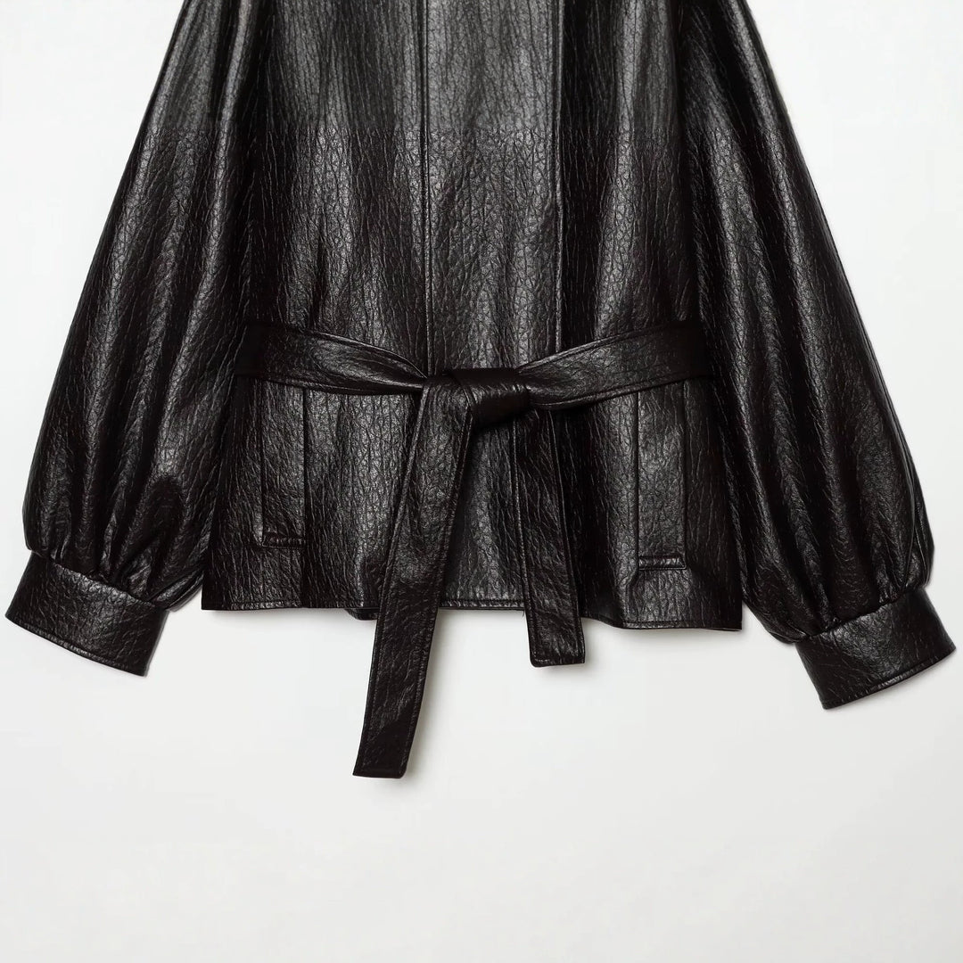 Women's short jacket made of faux leather with high buckle collar and waist belt Mune Fashion