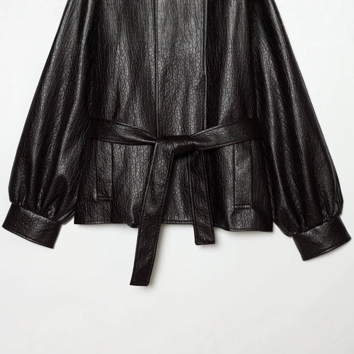 Women's short jacket made of faux leather with high buckle collar and waist belt Mune Fashion