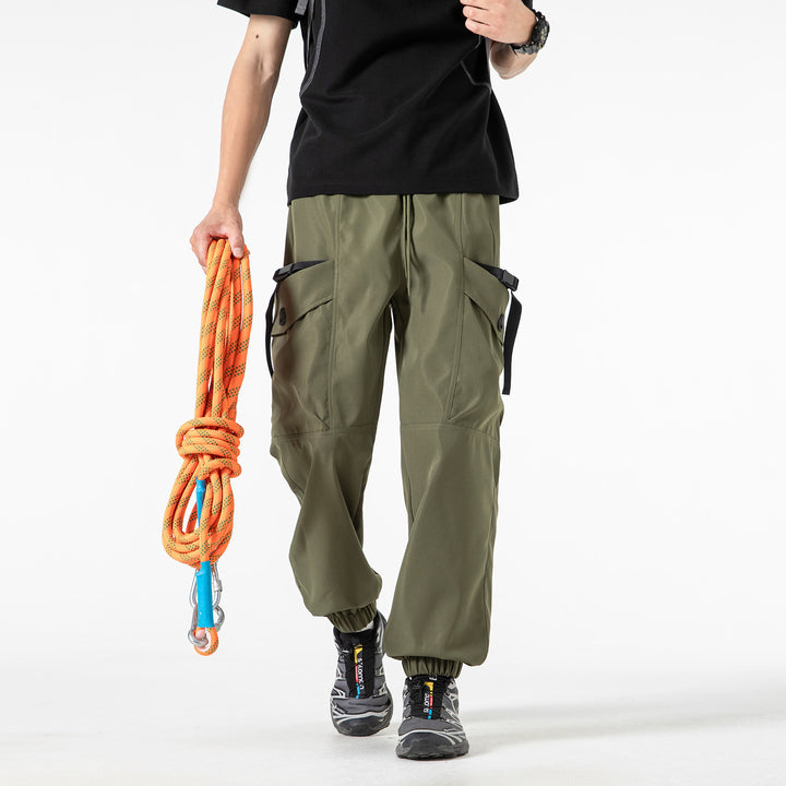 Unisex Wide Technical CargoJogging Pants with adjustable drawstring, large flap pockets, and elastic ankle cuffs Drune