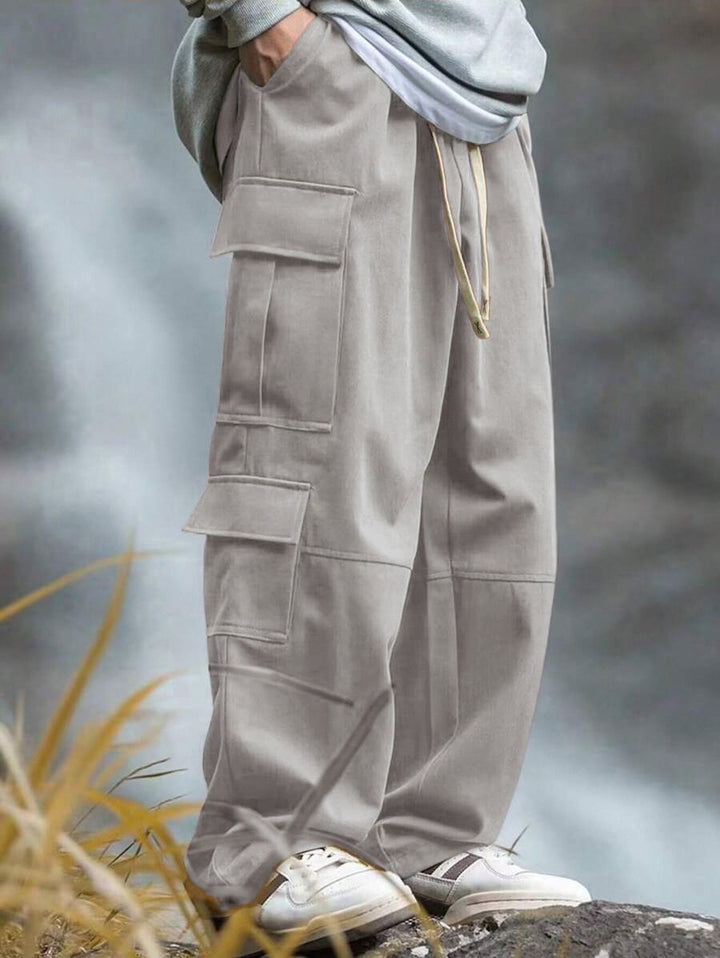 Men's loose cargo pants with multiple pockets, drawstring and reinforced knee areas Mune Fashion