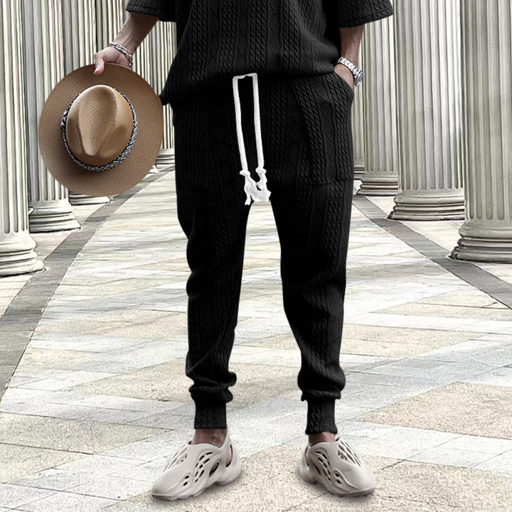Men's cable-knit joggers with drawstring, patch pockets, and ribbed cuffs Mune Fashion