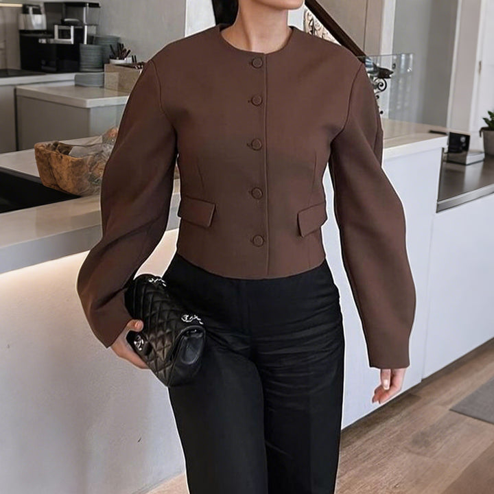 Women's oversized wool jacket with snap button placket, boxy silhouette, and patch pockets Mune Fashion