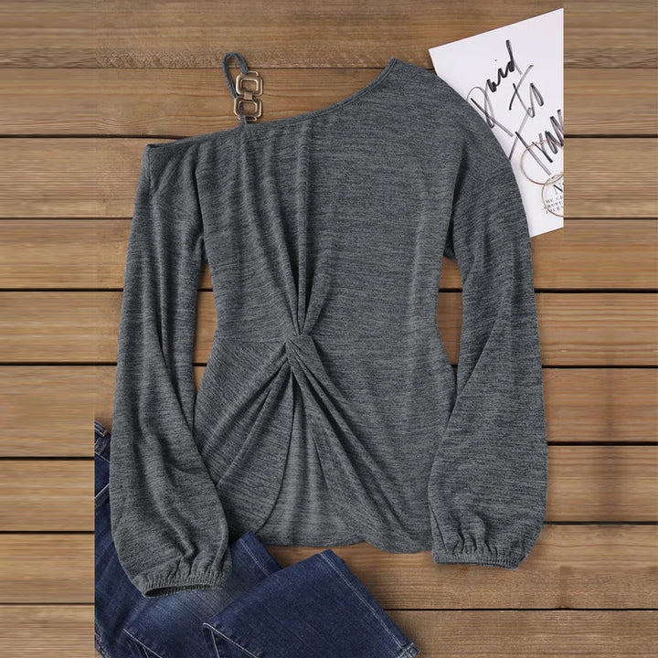Women’s asymmetrical off-shoulder knit sweater with decorative chain strap and twisted knot front Mune Fashion