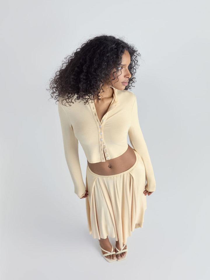 Women Cropped Cardigan with Pearl Buttons and Asymmetrical Pointed Midi Skirt Drune