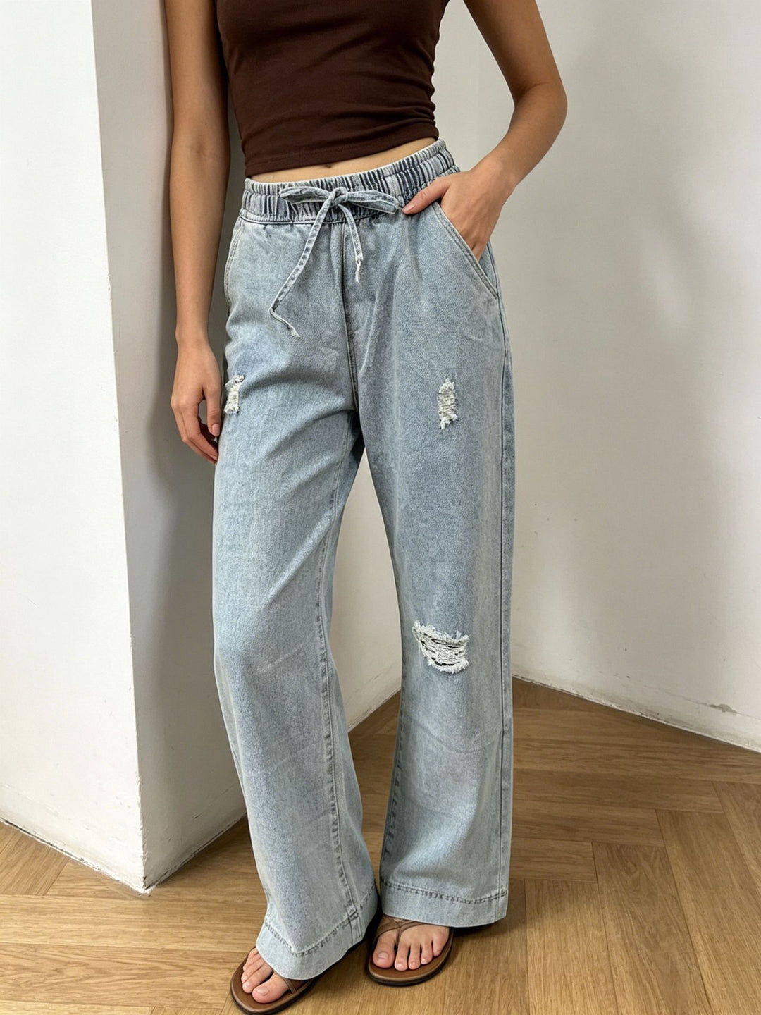 Women's wide denim pants with elastic drawstring waistband, used effects and relaxed fit Mune Fashion