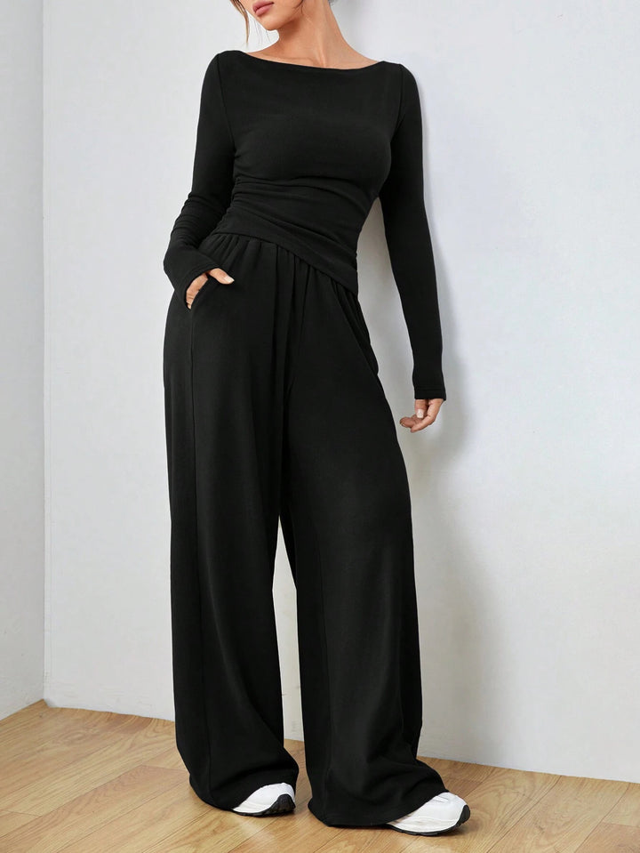 Women’s loungewear set made of softly falling jersey with a boat neckline, fitted long sleeve, and wide palazzo pants Mune Fashion