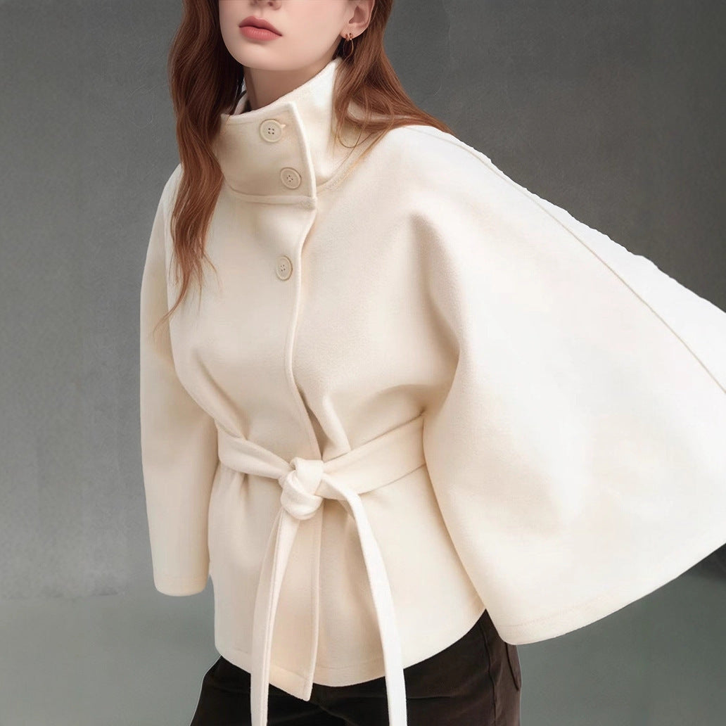 Women's short cape jacket with high stand-up collar, tie belt and boxy silhouette Mune Fashion