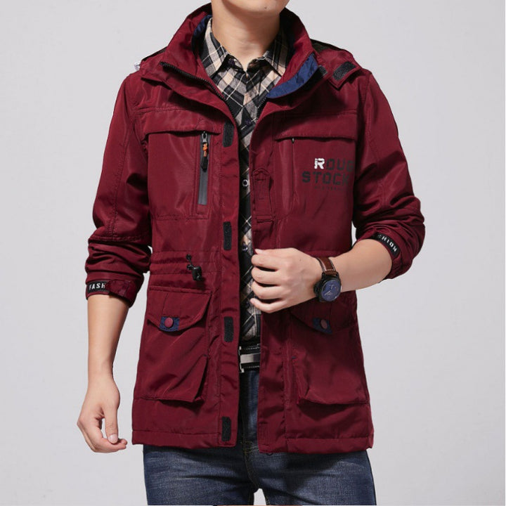 Men's lightweight windproof field jacket with breathable mesh inner lining, numerous zipper and flap pockets, as well as adjustable sleeve cuffs.