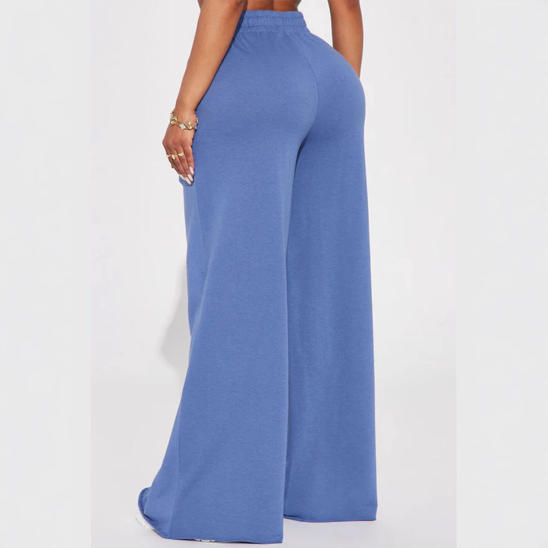 Ladies high-waist palazzo trousers made of French terry with wide legs, elastic comfort waistband and open hem edges Mune Fashion