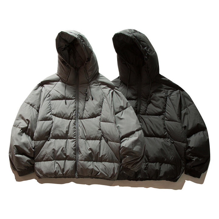 Unisex Oversize quilted jacket in boxy cut with hood and adjustable hem Mune Fashion