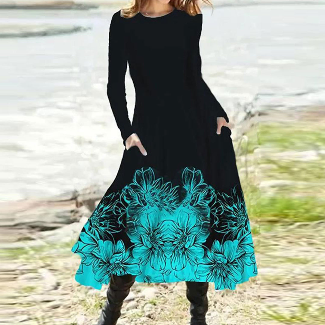 Women's flowing maxi dress with tie-dye circle pattern, round neckline, waist seam, and side pockets Mune Fashion