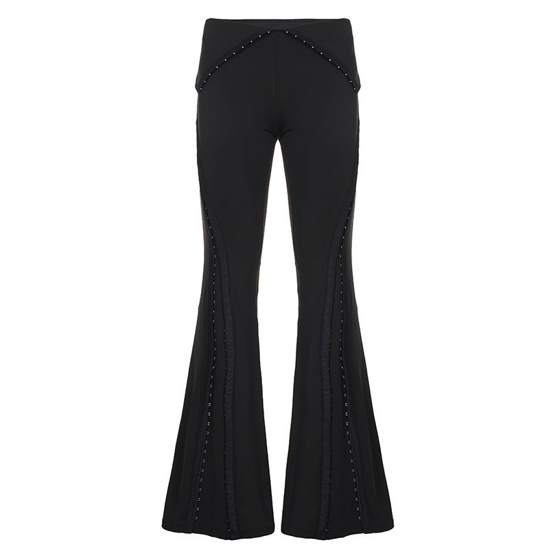 Women’s flared trousers with V waistband, side insert panels and decorative rivets Mune Fashion