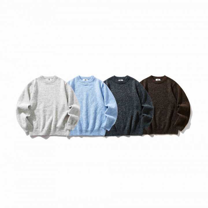Unisex Oversize fine knit sweater with round neckline, ribbed cuffs, and mottled wool blend Mune Fashion