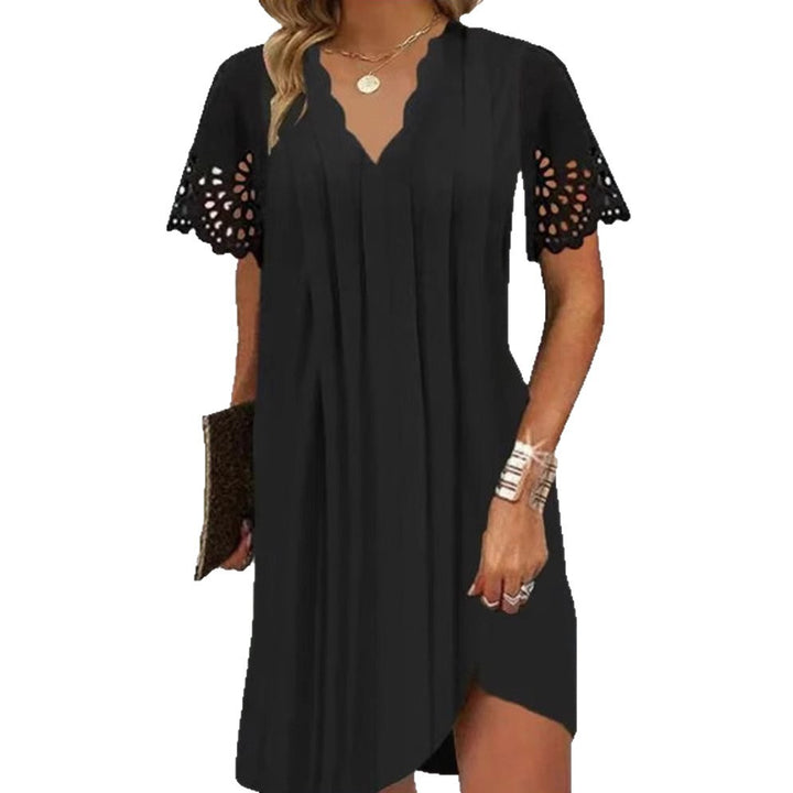 Women's light summer dress with jagged V-neck, openwork sleeves, and curved hem Mune Fashion