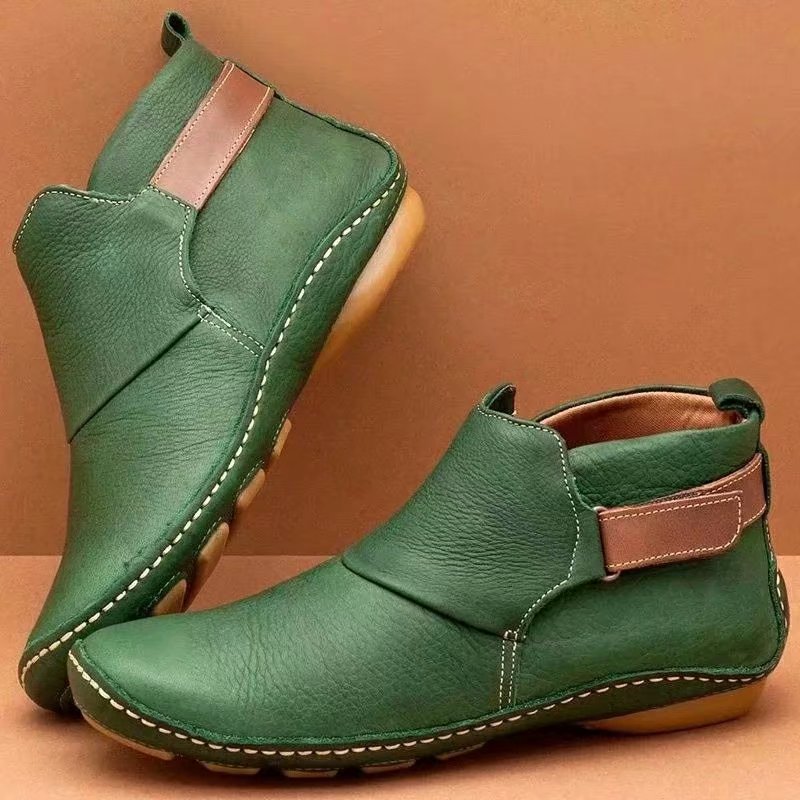 Women's ankle-high slip-on boots made of soft synthetic leather with adjustable hook-and-loop strap and hand-stitched moccasin seam Mune Fashion