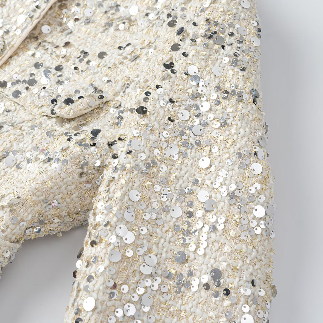 Women's short jacket made of bouclé with sequin trim, decorative pearl buttons, and a belted waist Mune Fashion