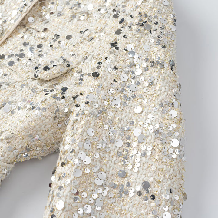 Women's short jacket made of bouclé with sequin trim, decorative pearl buttons, and a belted waist Mune Fashion