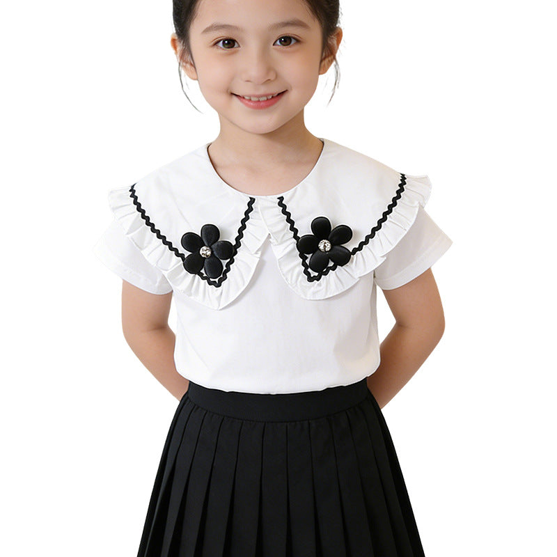 Girl's blouse with ruffled hem and floral design Mune Fashion