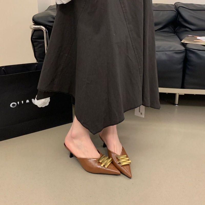 Ladies pointed toe leather look mules with sculpted kitten heel and gold wave appliqué Mune Fashion