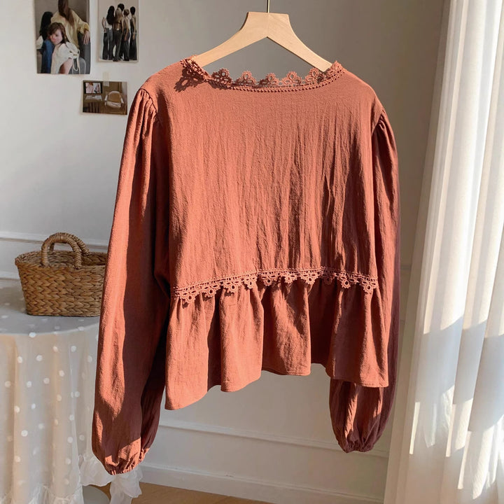 Women’s short blouse with empire cut, V-neck, lace trim, and tie bow Mune Fashion