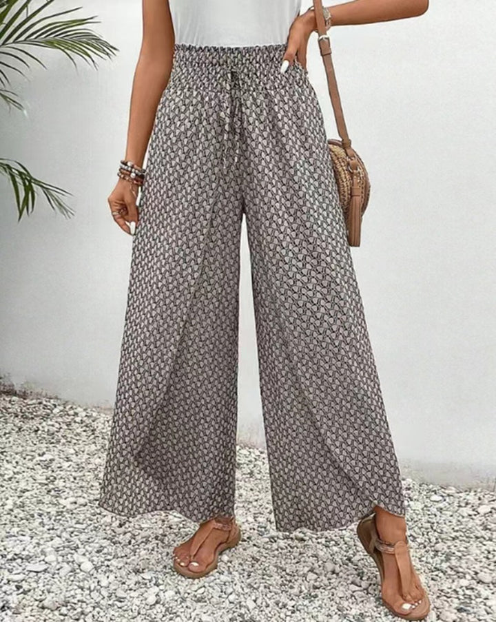 Women's loose summer pants with smocked elastic waistband and palazzo silhouette Mune Fashion
