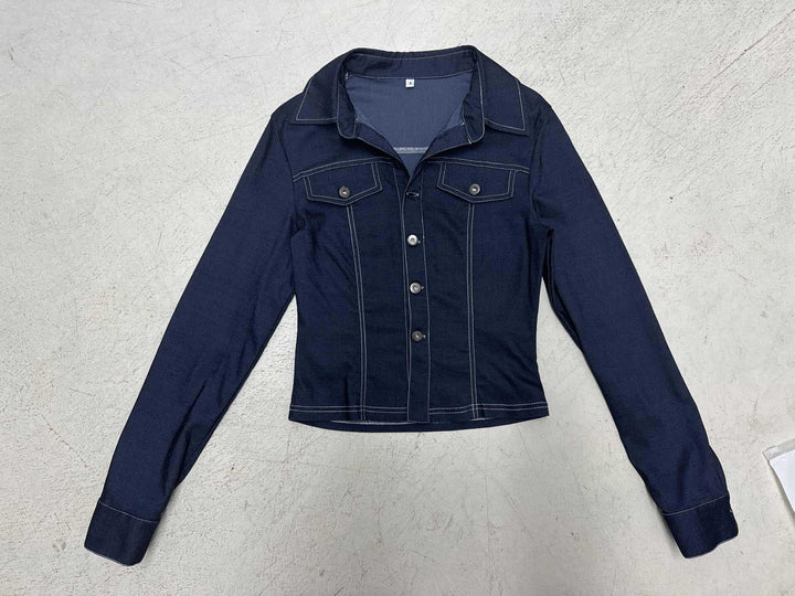 Women's fitted denim jacket with striking contrast seams, chest pockets, and figure-flattering cut Mune Fashion