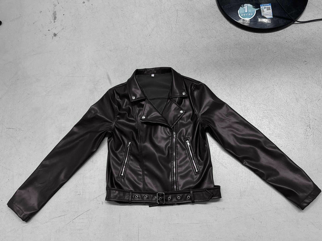Women's fitted biker jacket made of faux leather with asymmetrical zipper, metallic details, and waist belt Mune Fashion