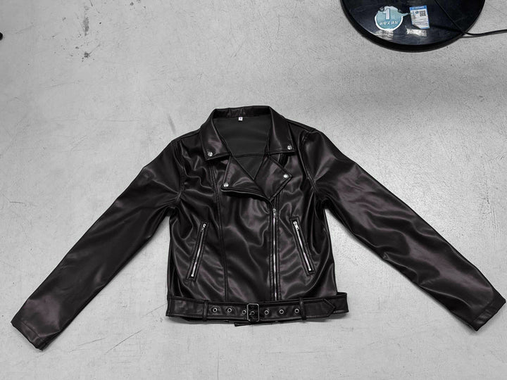 Women's fitted biker jacket made of faux leather with asymmetrical zipper, metallic details, and waist belt Mune Fashion