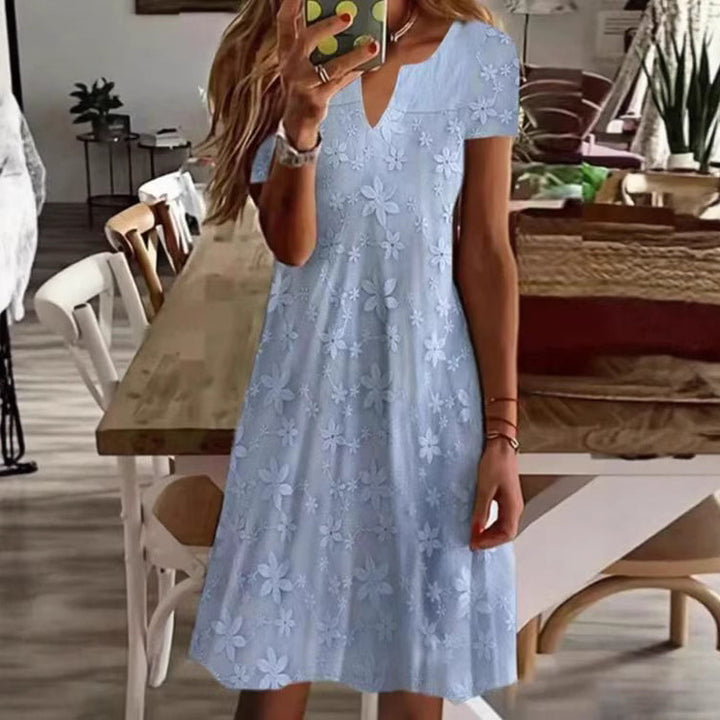 Women's knee-length A-line dress made of cotton blend with embroidered broderie overlay, short sleeves and V-neck Mune Fashion