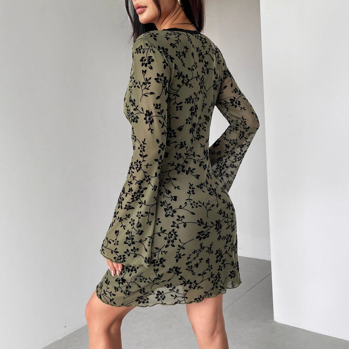 Women's fitted mesh mini dress with velvet flock floral pattern, deep V-neckline and bow appliqué Mune Fashion