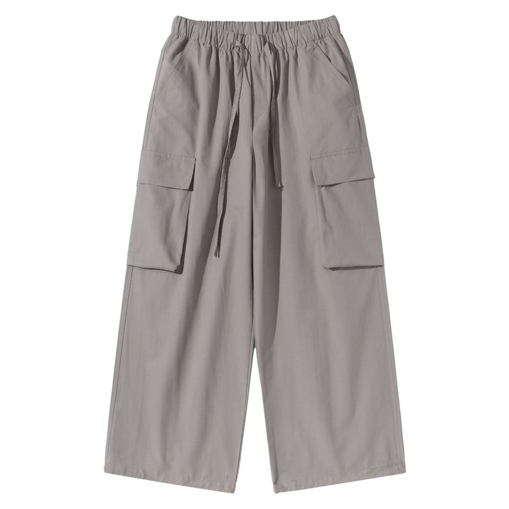 Women's culotte cargo bermudas in utility look with elastic tunnel drawstring waistband and large flap pockets.