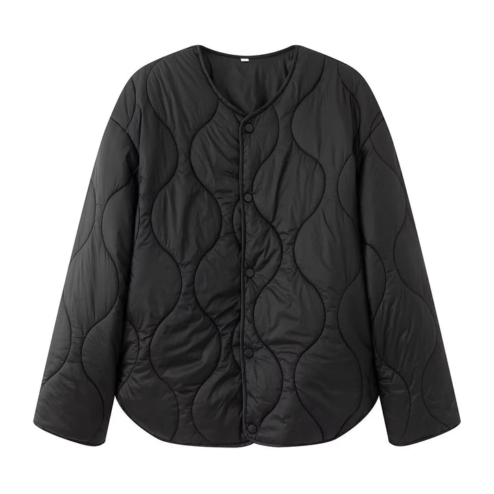 Women's quilted transition jacket with round neckline, snap button closure, and curved hem Mune Fashion