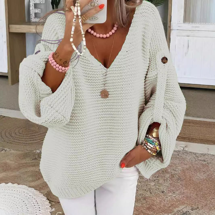 Women loose knit sweater with V-neck, balloon sleeves and button detail Mune Fashion