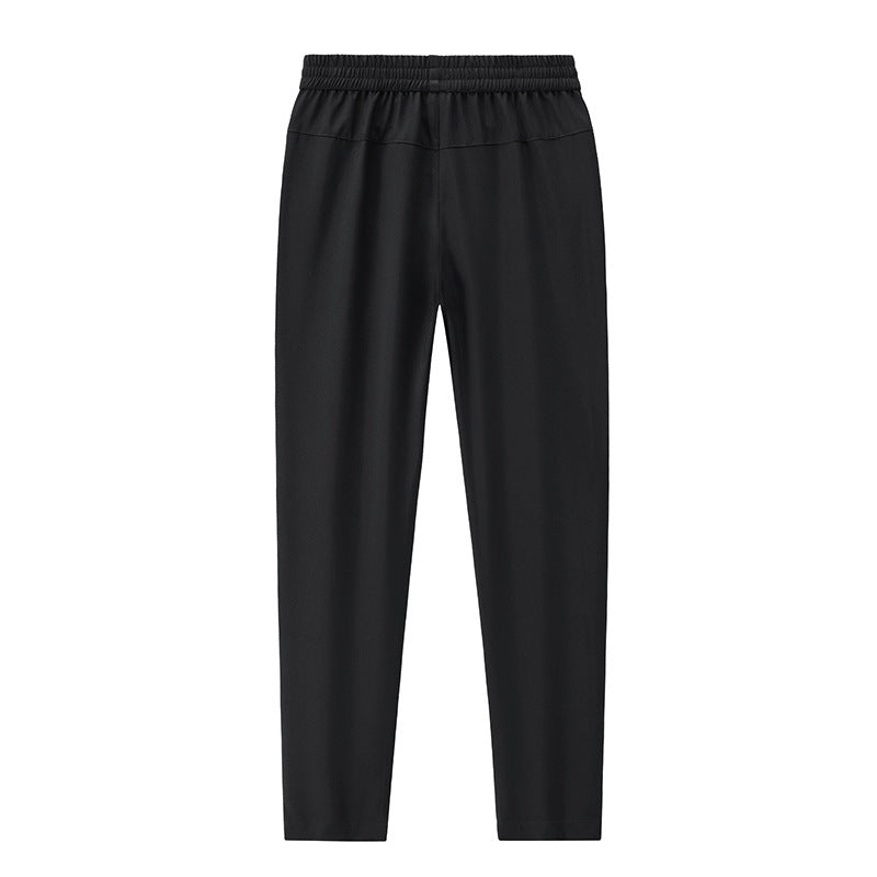 Men's Sportive Tapered Jogging Pants with Elastic Waistband, Zipper Pockets and Breathable Functional Material Mune Fashion