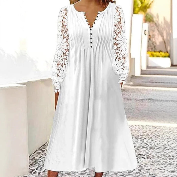 Ladies' knee-length A-line summer dress with crocheted long sleeves, pleated bodice and decorative button placket Mune Fashion