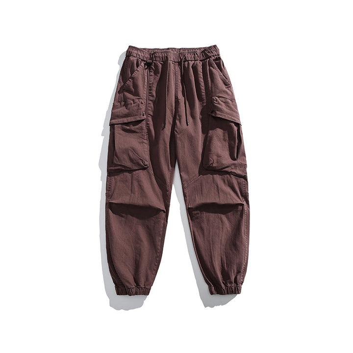 Men's utility cargo pants with elastic waistband, multiple pockets, and elastic cuffs.