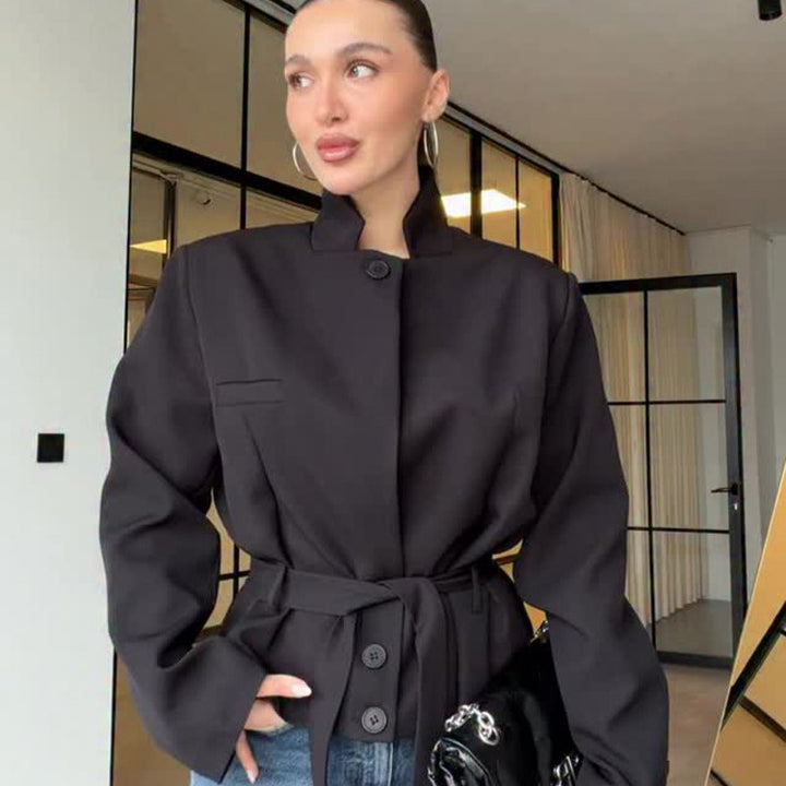 Women's tailored short blazer with standing collar, peplum, and tie belt Mune Fashion