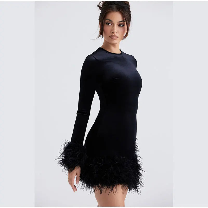 Mune | Elegant fitted dress with feather embellishments on the Sleeves
